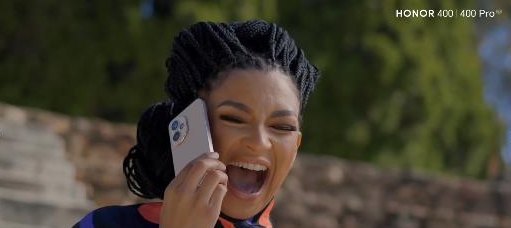 A creator laughing on the HONOR 400 Pro