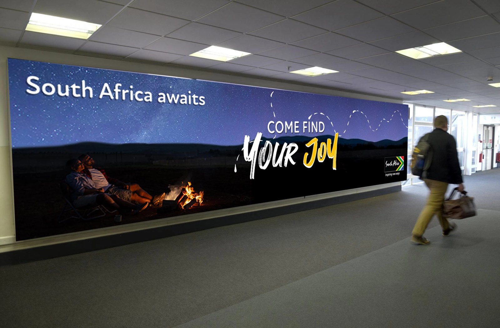 Come Find Your Joy billboard in an airport walkway