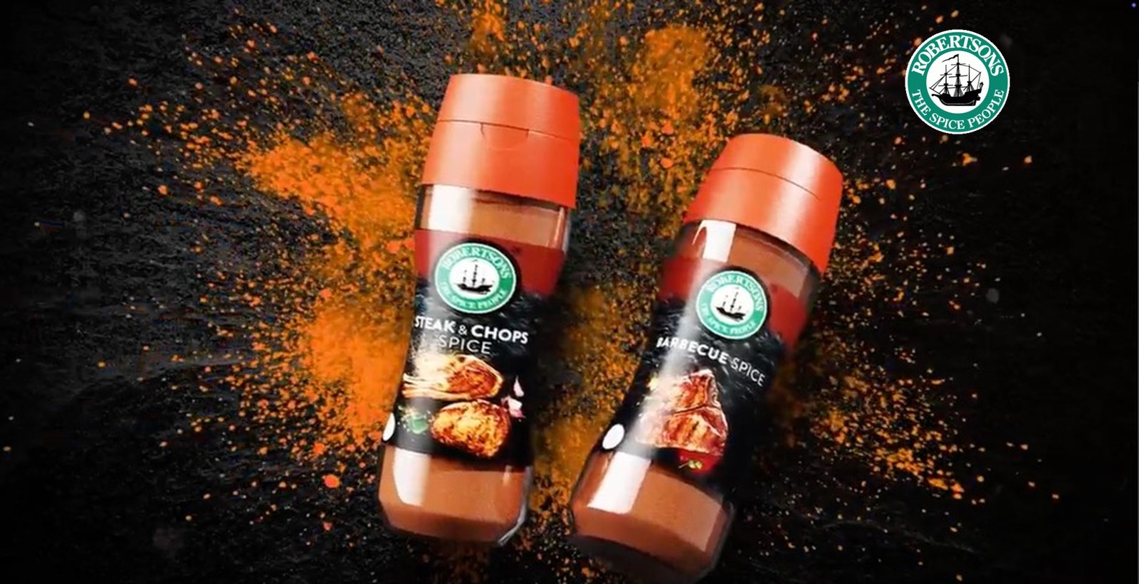 Robertsons spice jars in a burst of paprika, with the Robertsons logo